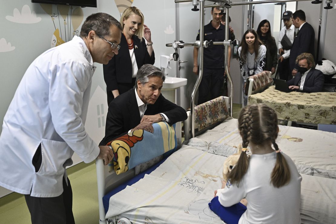 US Secretary of State Antony Blinken talks with Maryna, 6, from Kherson region, during his visit to a children hospital in Kyiv.