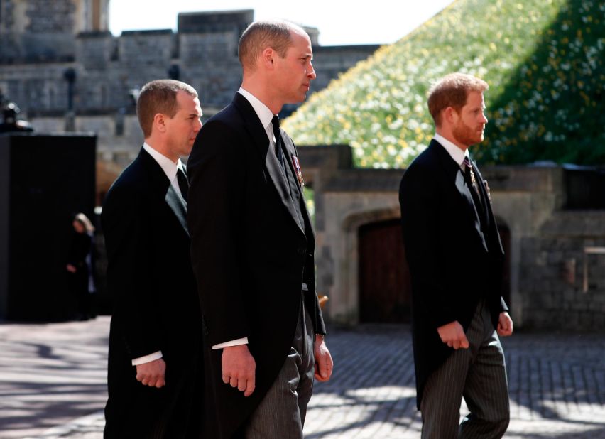 William and Harry are joined by Peter Phillips, left, during a ceremonial procession at the funeral of Prince Philip in April 2021.