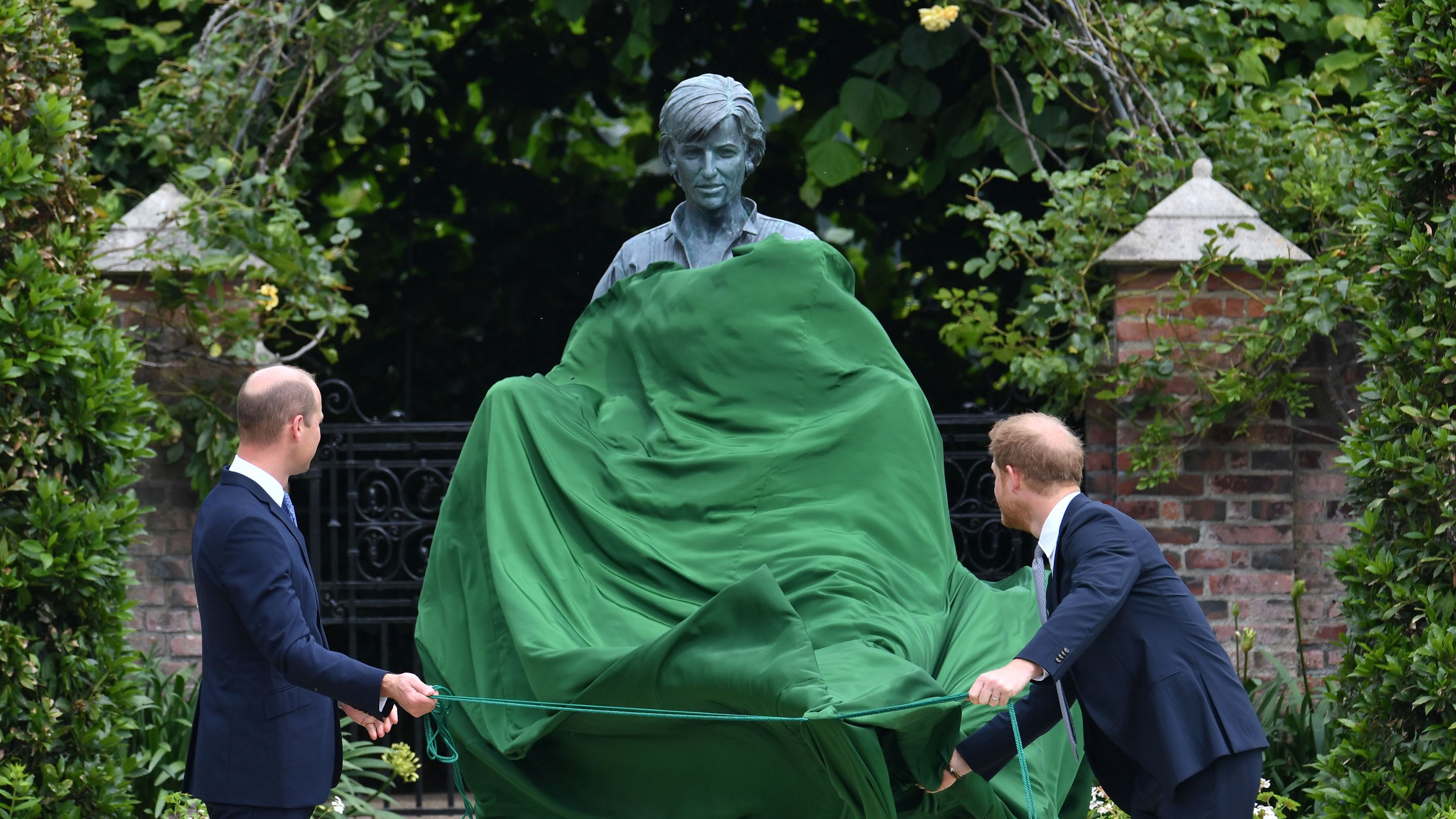 William and Harry unveil a statue they commissioned of their mother on what would have been her 60th birthday in July 2021.