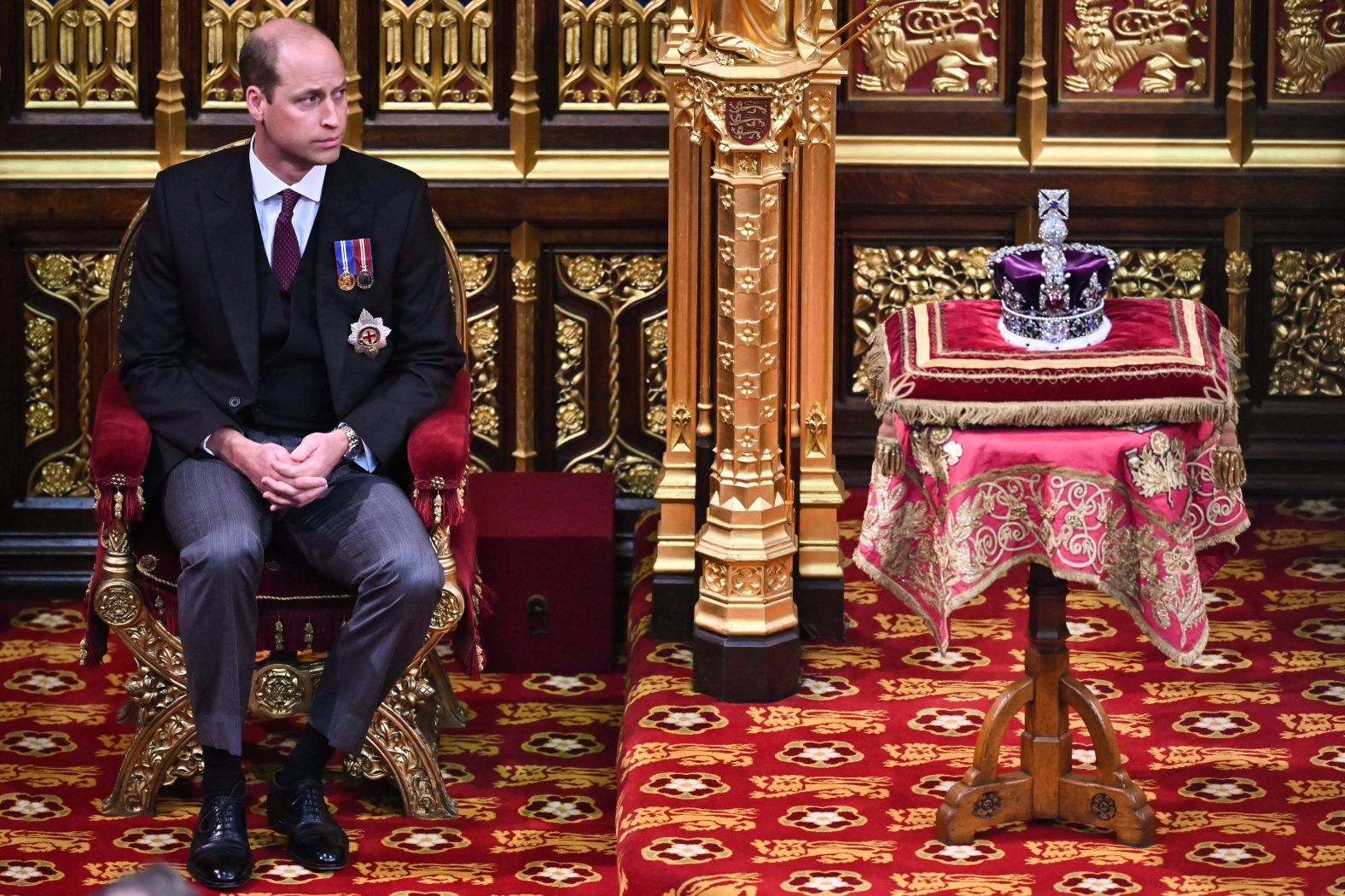 Prince William sits by the Imperial State Crown during the opening of Parliament in May 2022.