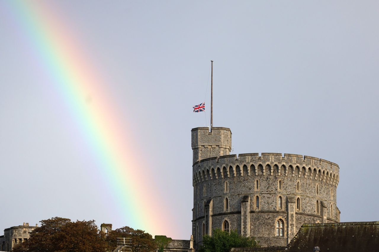 A rainbow is seen near Windsor Castle as the Union Flag is lowered after the Queen's death.