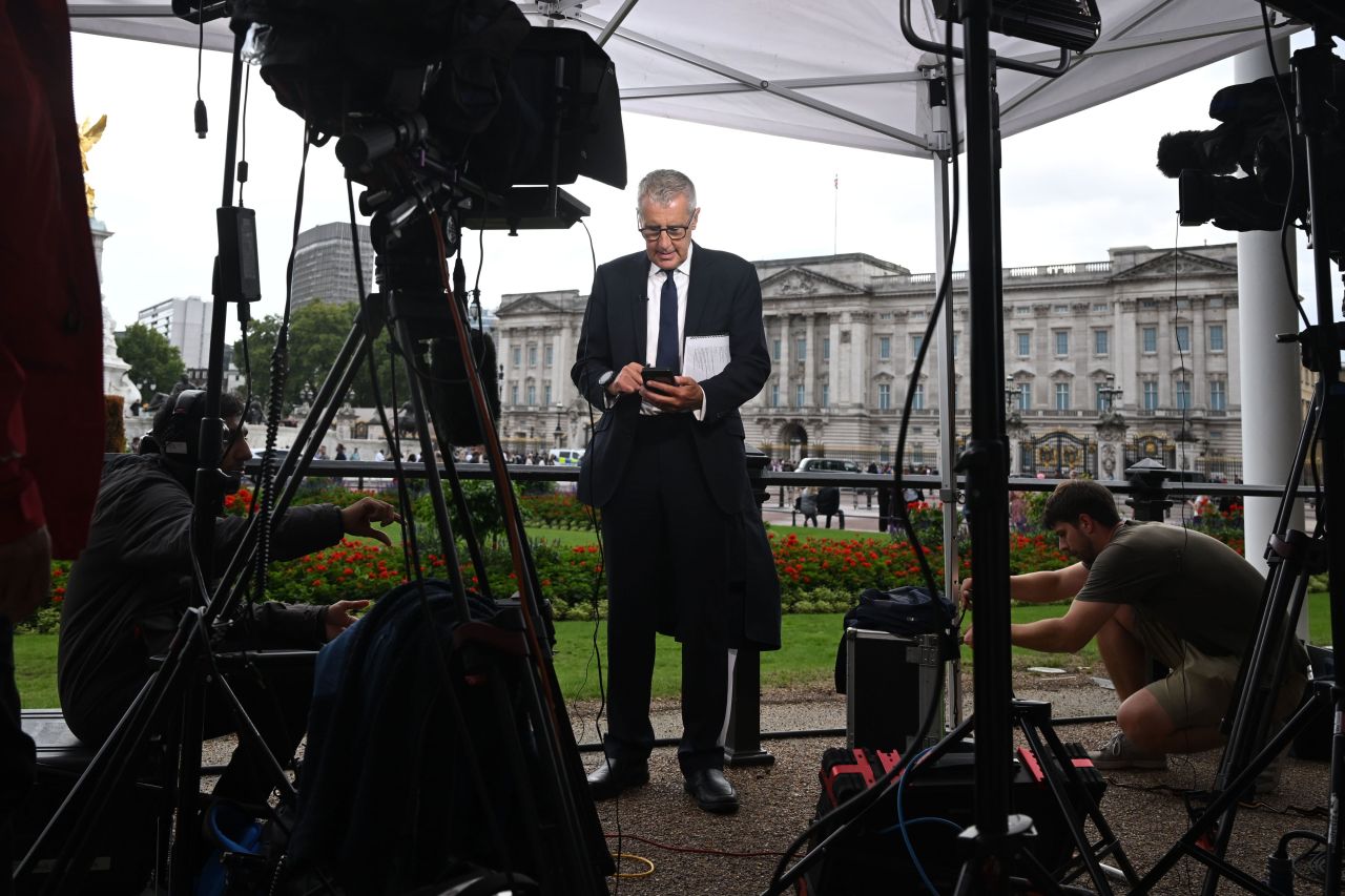 Television crews and media work outside Buckingham Palace on Thursday.