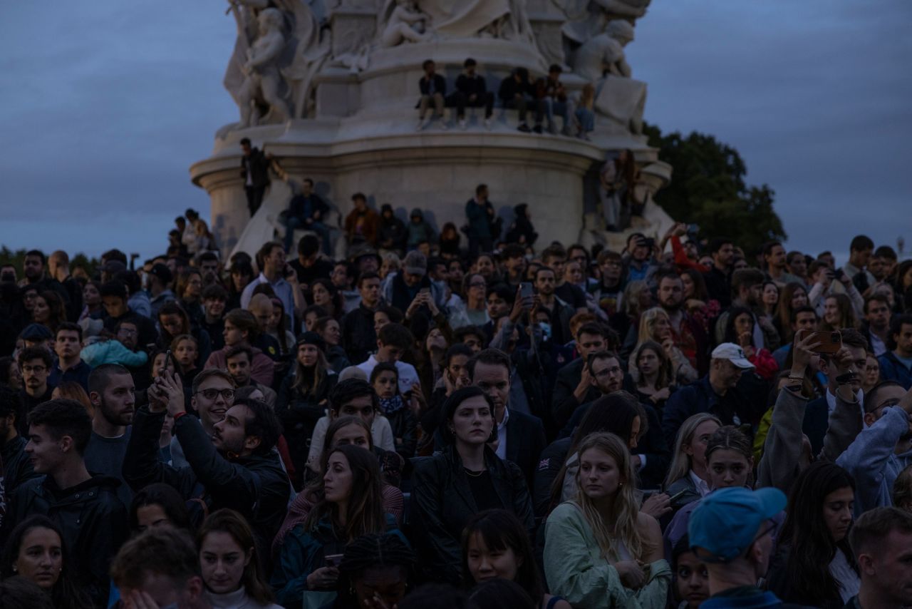 Crowds gather on the Queen Victoria Memorial in front of Buckingham Palace on Thursday.