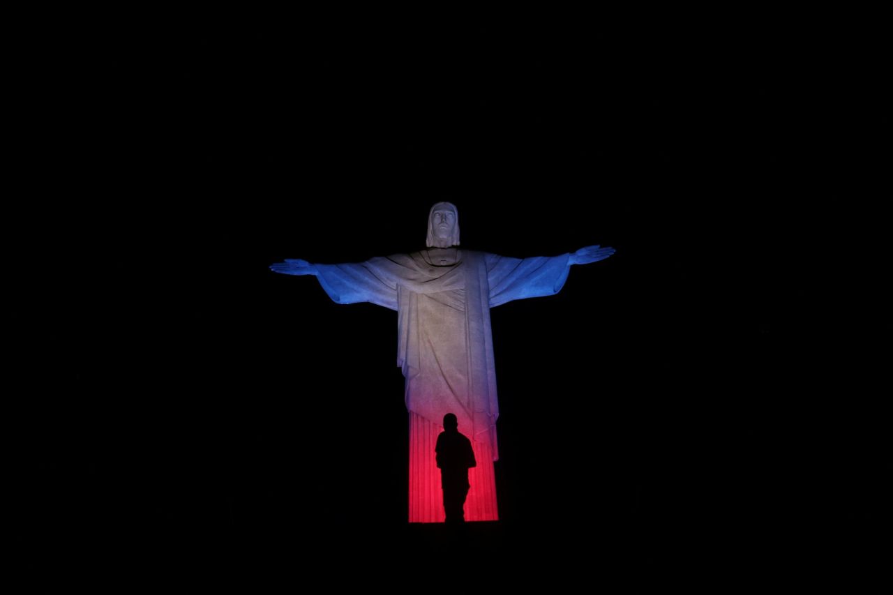 The Christ the Redeemer statue in Rio de Janeiro is illuminated with the colors of the Union Jack flag Thursday after Brazil's government decreed three days of mourning following the Queen's death.