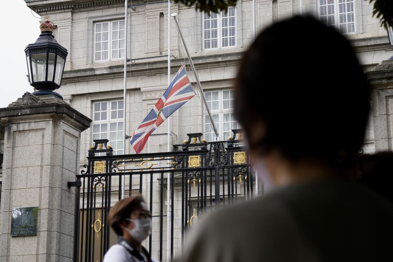 The Union Jack flag is flown at half-staff outside the British Embassy in Tokyo.