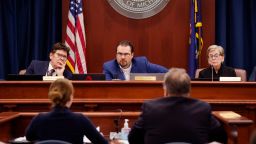 Members of the Michigan Board of State Canvassers, from left, Richard Houskamp, Anthony Daunt and Mary Ellen Gurewitz listen to attorneys Olivia Flower and Steve Liedel during a hearing, Wednesday, Aug. 31, 2022, in Lansing, Michigan .