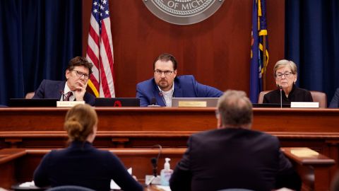 Members of the Michigan Board of State Canvassers listen to attorneys during a hearing on Wednesday, August 31, 2022, in Lansing, Michigan.