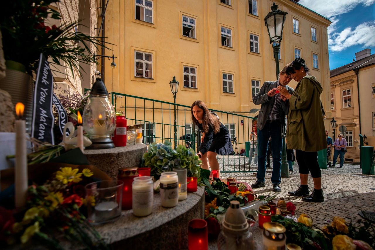 People light candles to pay tribute to the Queen in front of the British Embassy in Prague, Czech Republic.