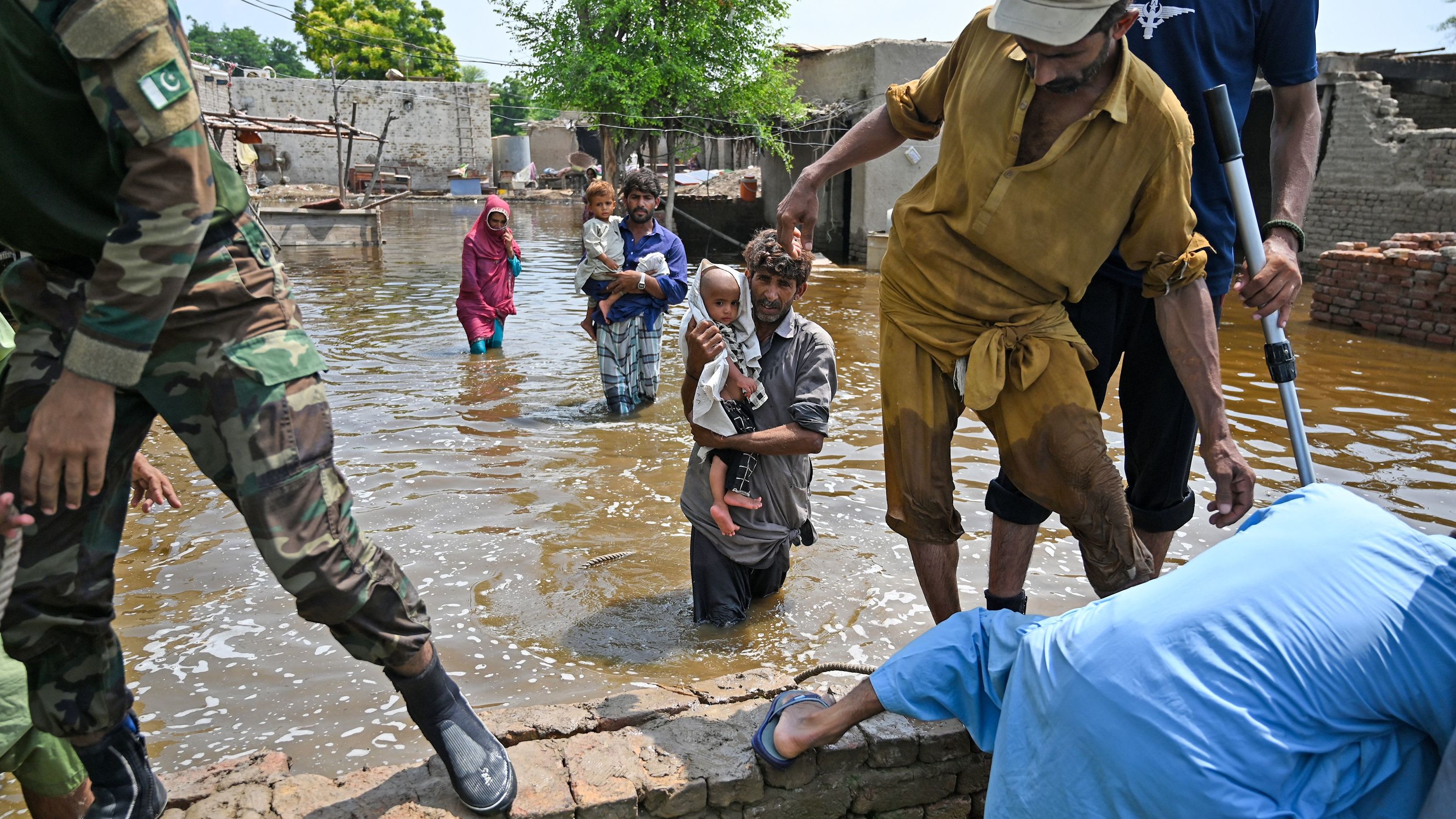 Pakistani naval personnel rescue flood-affected people in the country's Dadu district on Wednesday, September 7. <a href="https://www.cnn.com/2022/08/29/world/gallery/pakistan-flooding/index.html" target="_blank">Severe flooding</a> has killed more than 1,300 people in Pakistan since mid-June, officials said, and by the end of August more than a third of the country was underwater, according to satellite images from the European Space Agency.