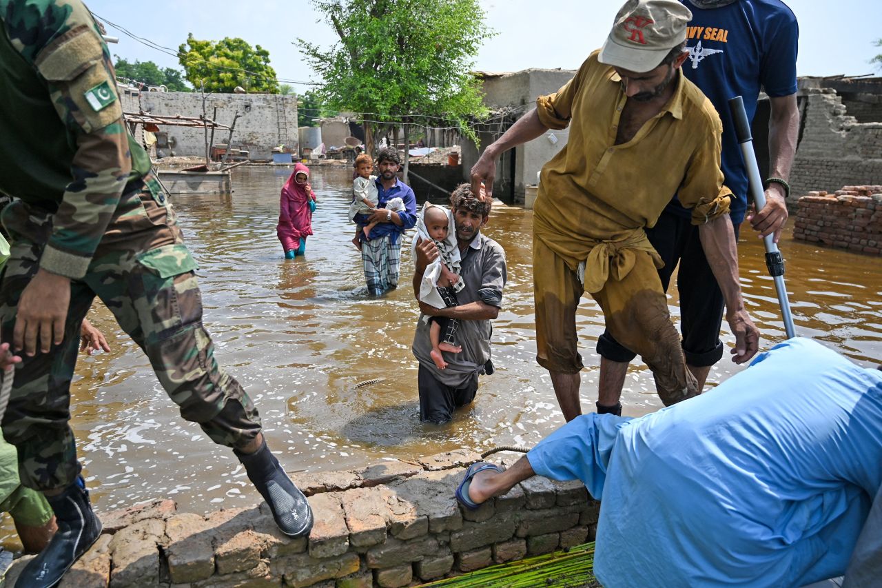 Pakistani naval personnel rescue flood-affected people in the country's Dadu district on Wednesday, September 7. <a href="https://www.cnn.com/2022/08/29/world/gallery/pakistan-flooding/index.html" target="_blank">Severe flooding</a> has killed more than 1,300 people in Pakistan since mid-June, officials said, and by the end of August more than a third of the country was underwater, according to satellite images from the European Space Agency.