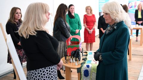 Camilla listens to staff, supporters and service users as they speak of their challenges during a visit to the Belfast & Lisburn Women's Aid, which supports those affected by domestic violence, in Belfast on September 30, 2020.