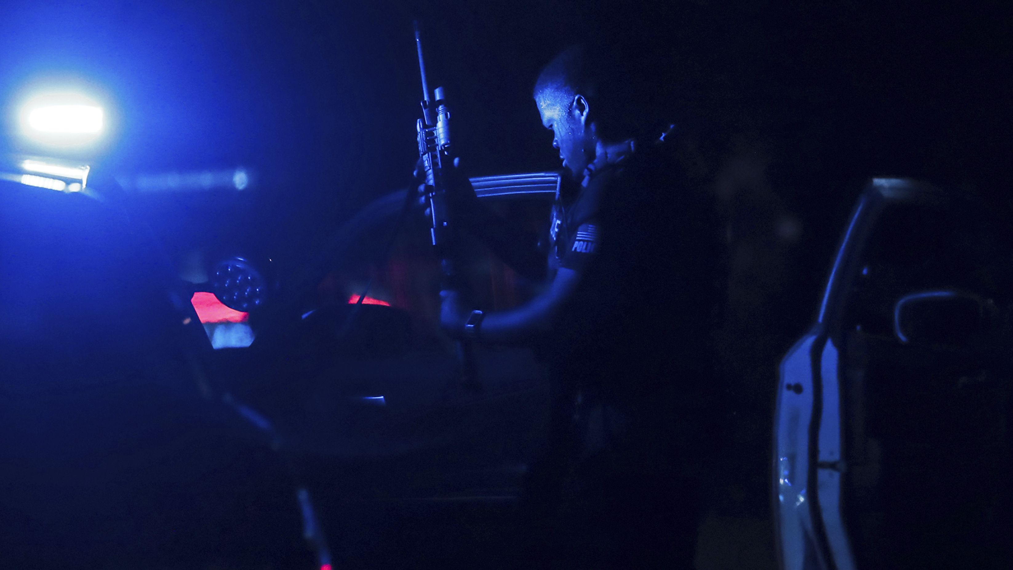 A police officer loads his gun at a crime scene in Memphis, Tennessee, on Wednesday, September 7. A 19-year-old man was arrested Wednesday after livestreaming part of a <a href="https://www.cnn.com/2022/09/07/us/memphis-shootings-suspect-detained/index.html" target="_blank">shooting rampage</a> that left four people dead and three others injured, police said.