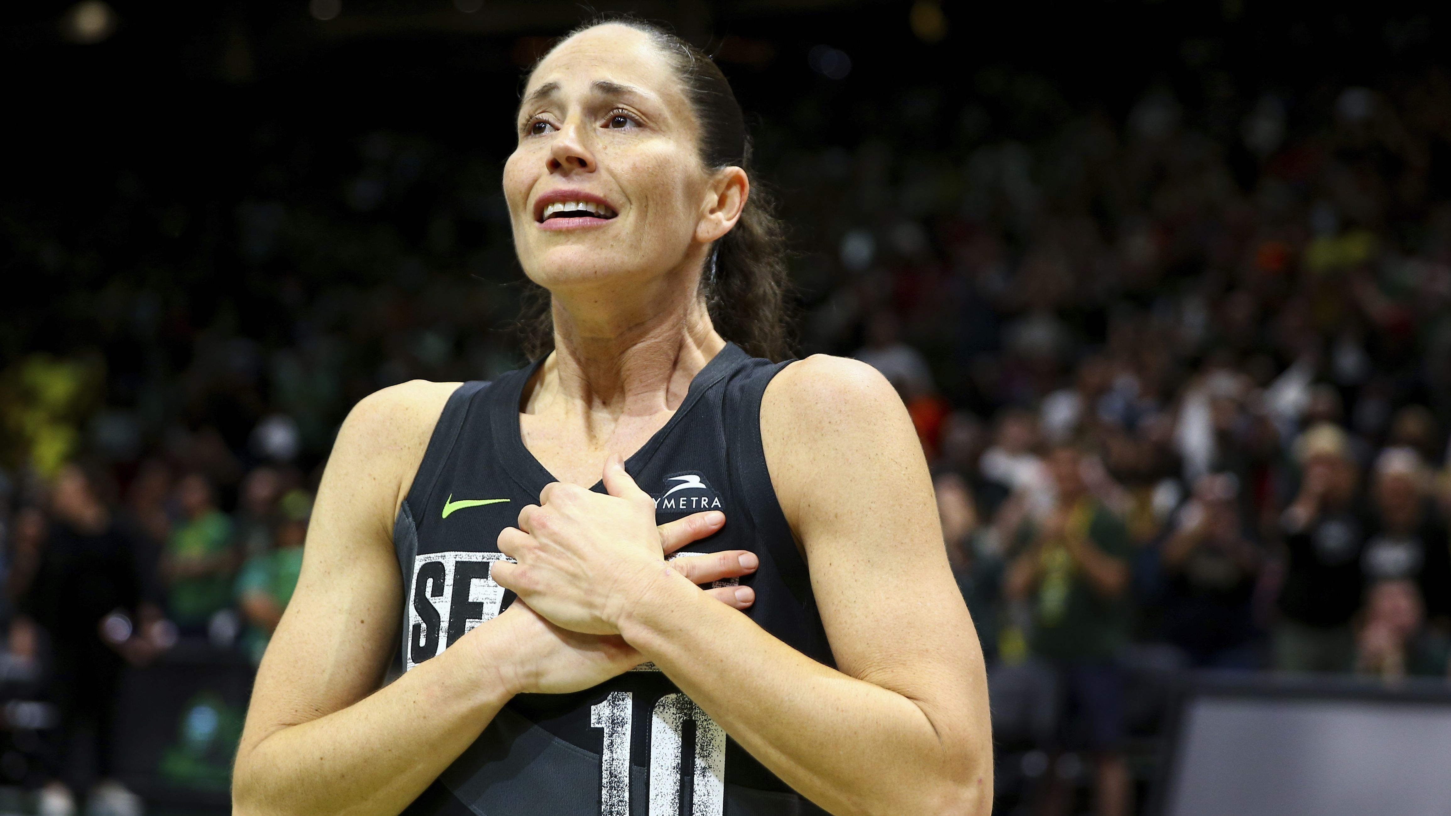 Seattle guard Sue Bird reacts to fans chanting "Thank you, Sue" after the Storm were eliminated from the WNBA playoffs on Tuesday, September 6. Bird, one of the best women's basketball players in history, is retiring after this season.