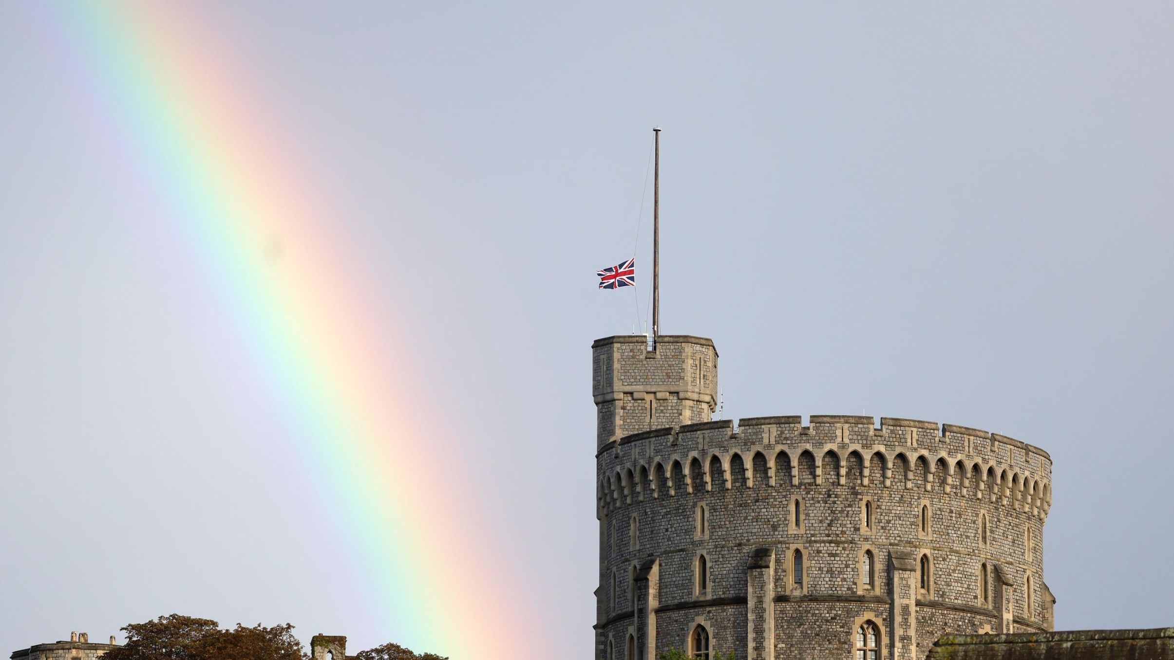A rainbow is seen near England's Windsor Castle as the Union Flag is lowered after the death of Queen Elizabeth II on Thursday, September 8.