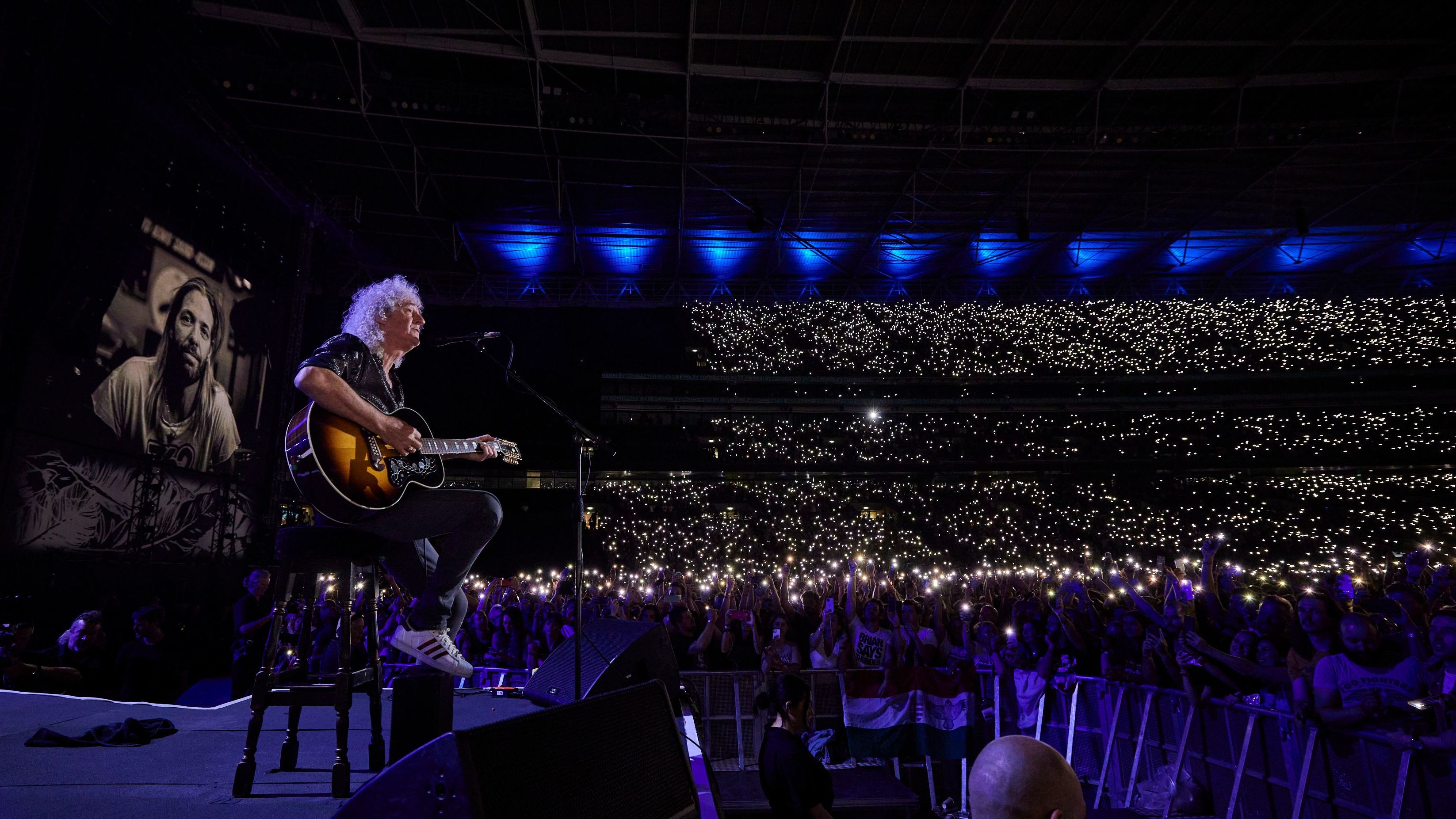 Queen's Brian May performs at a tribute concert in London for Foo Fighters drummer Taylor Hawkins on Saturday, September 3. Hawkins died in March at the age of 50. <a href="https://www.cnn.com/2022/09/04/uk/foo-fighters-taylor-hawkins-concert-intl-gbr-scli/index.html" target="_blank">A star-studded lineup,</a> which also included Paul McCartney and Liam Gallagher, joined the Foo Fighters for Saturday's concert.