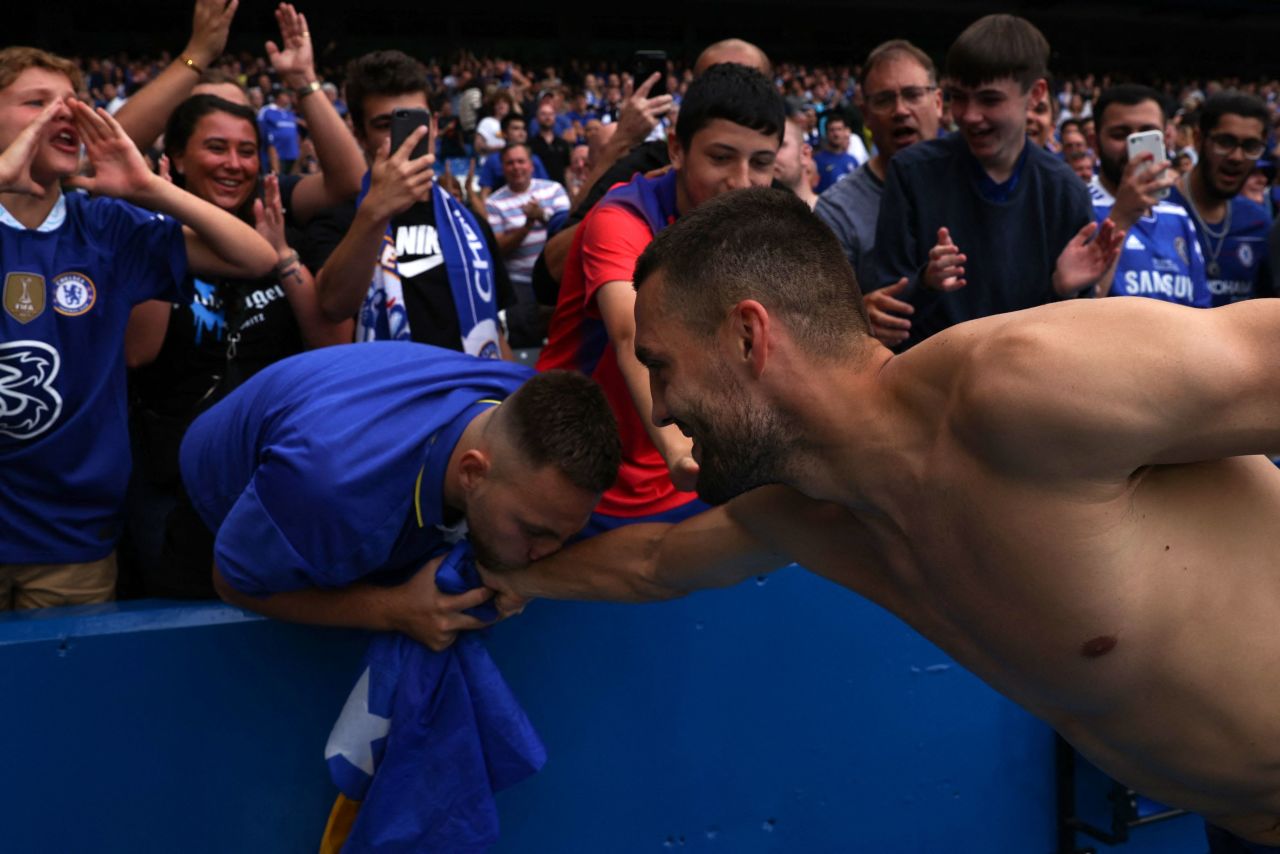 A fan kisses Chelsea's Mateo Kovacic after the player gave him his jersey following a Premier League match in London on Saturday, September 3.