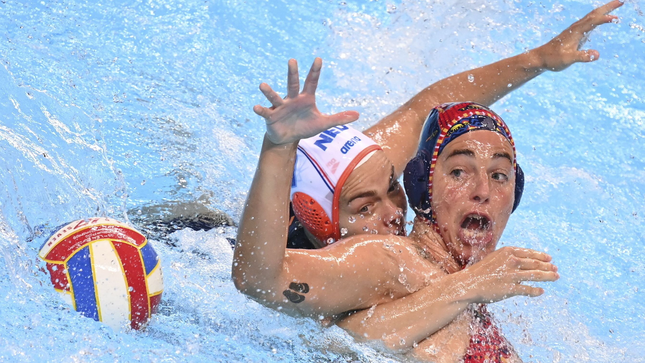 Dutch water polo player Bente Rogge, left, competes against Spain's Maica Garcia Godoy during a semifinal match at the European Water Polo Championships on Wednesday, September 7.