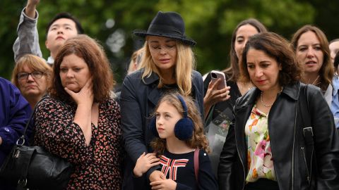 Mourners gather outside Buckingham Palace in London on Friday. 