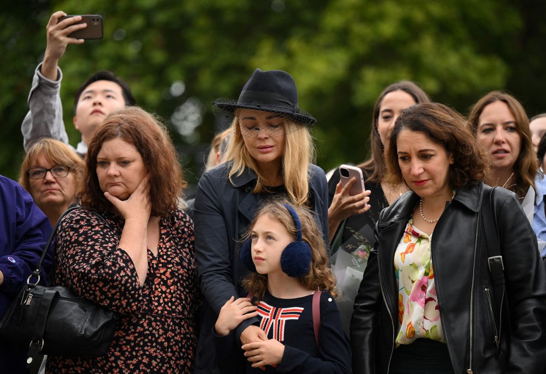 Mourners gather outside Buckingham Palace in London on Friday. 