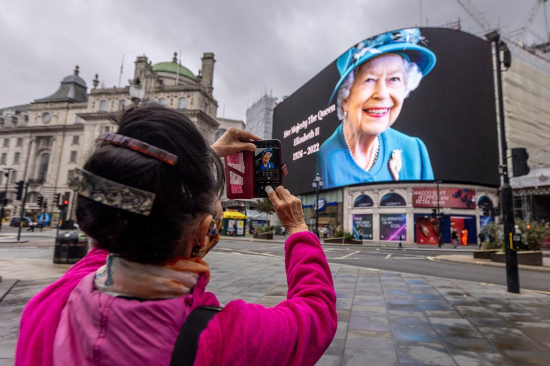 A portrait of Queen Elizabeth II on display in London's Piccadilly Circus on Friday morning.