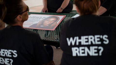 Women helping to search for Irene Gakwa display signs asking for information June 18 in Gillette, Wyoming.