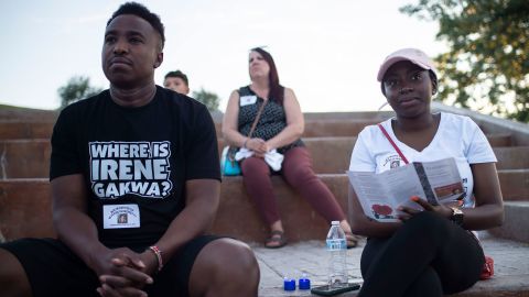 Chris Gakwa and his wife, Gyoice Abatey, attend a vigil for his missing sister, Irene Gakwa, at a park in Gillette, Wyoming. 