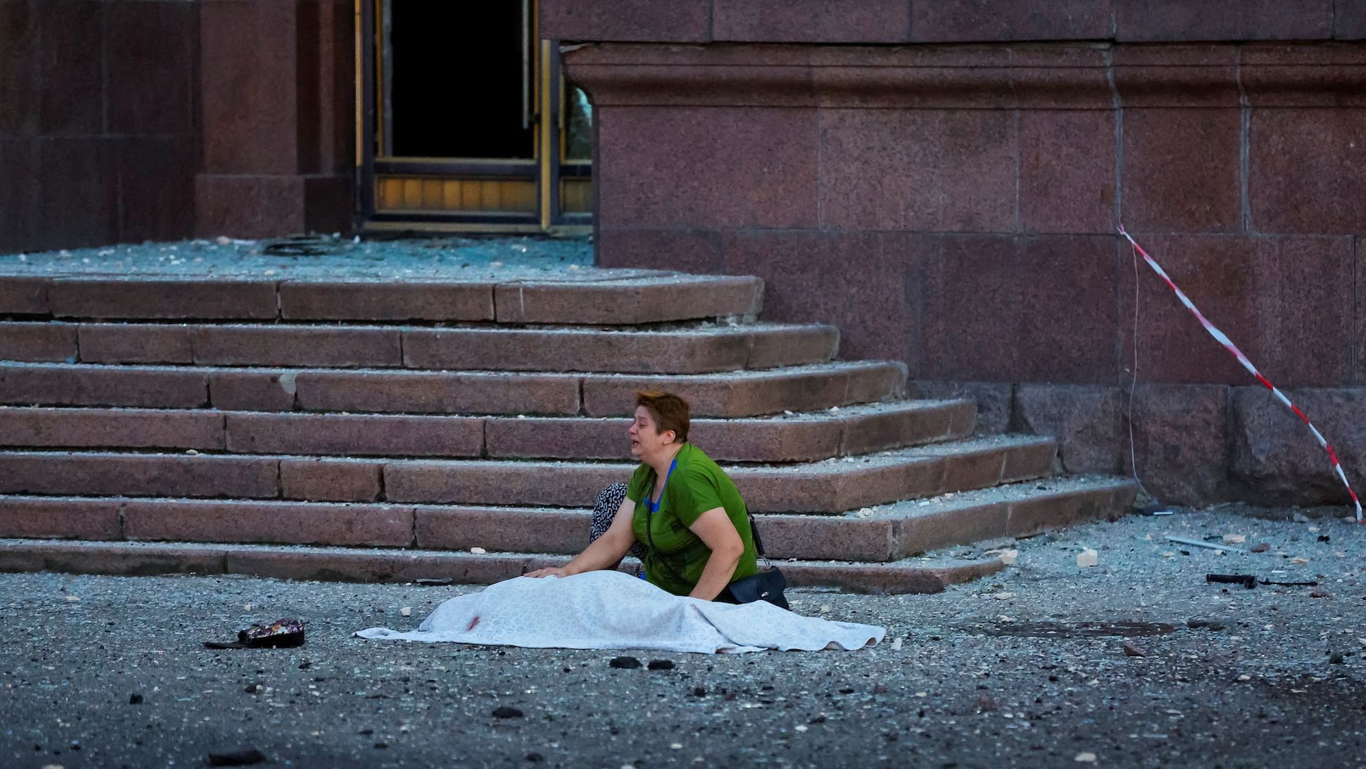 A woman reacts next to the body of her mother, who was killed by shelling in Donetsk, Ukraine, on Friday, September 2.