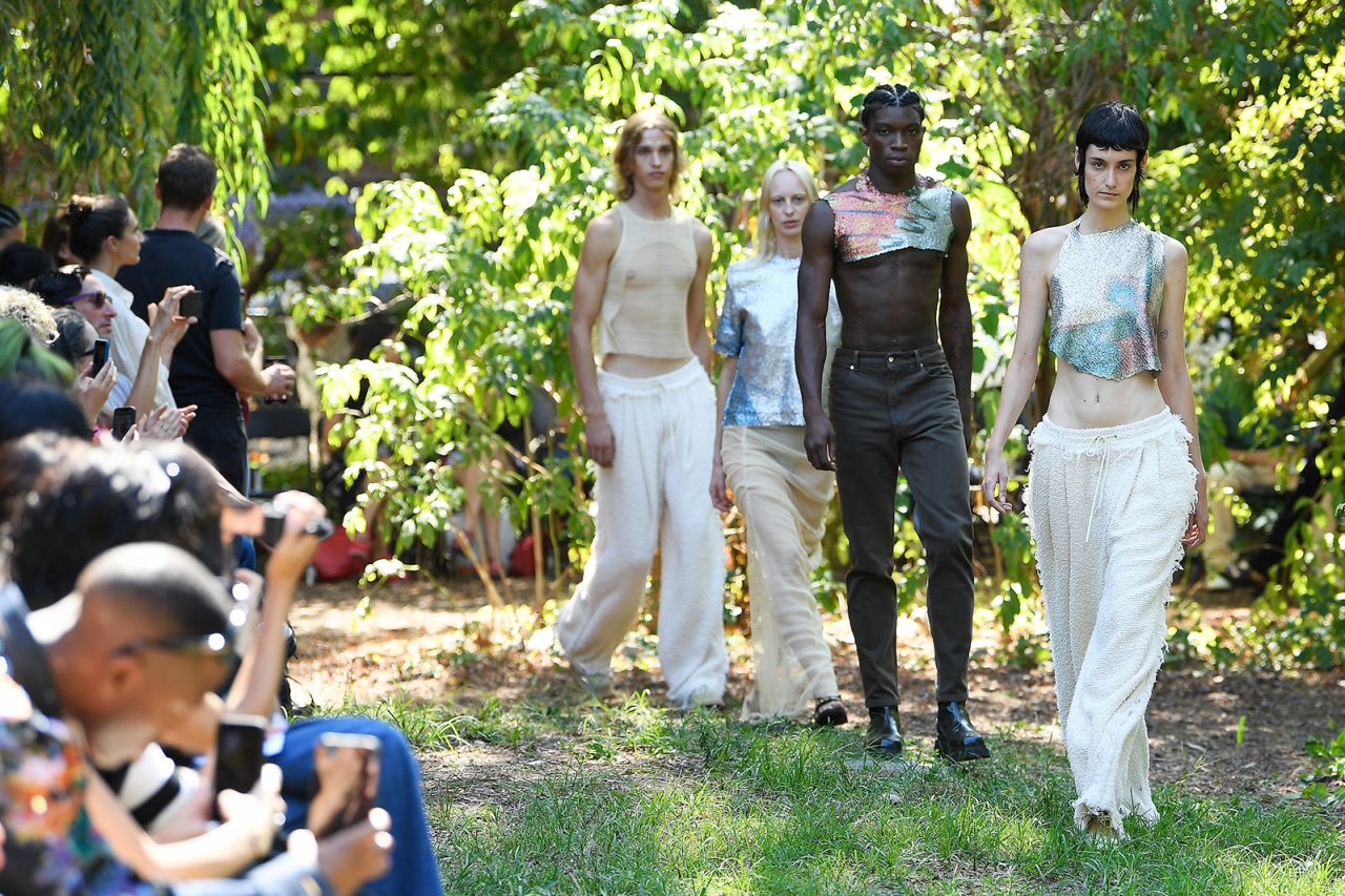 Eckhaus Latta's show was staged in El Jardin del Paraiso, a community garden in the East Village -- to the lilting tunes of a live harpist. Prints in the collection were from the archive of the deceased artist Matthew Underwood, a friend of the label's co-designer Zoe Latta.
