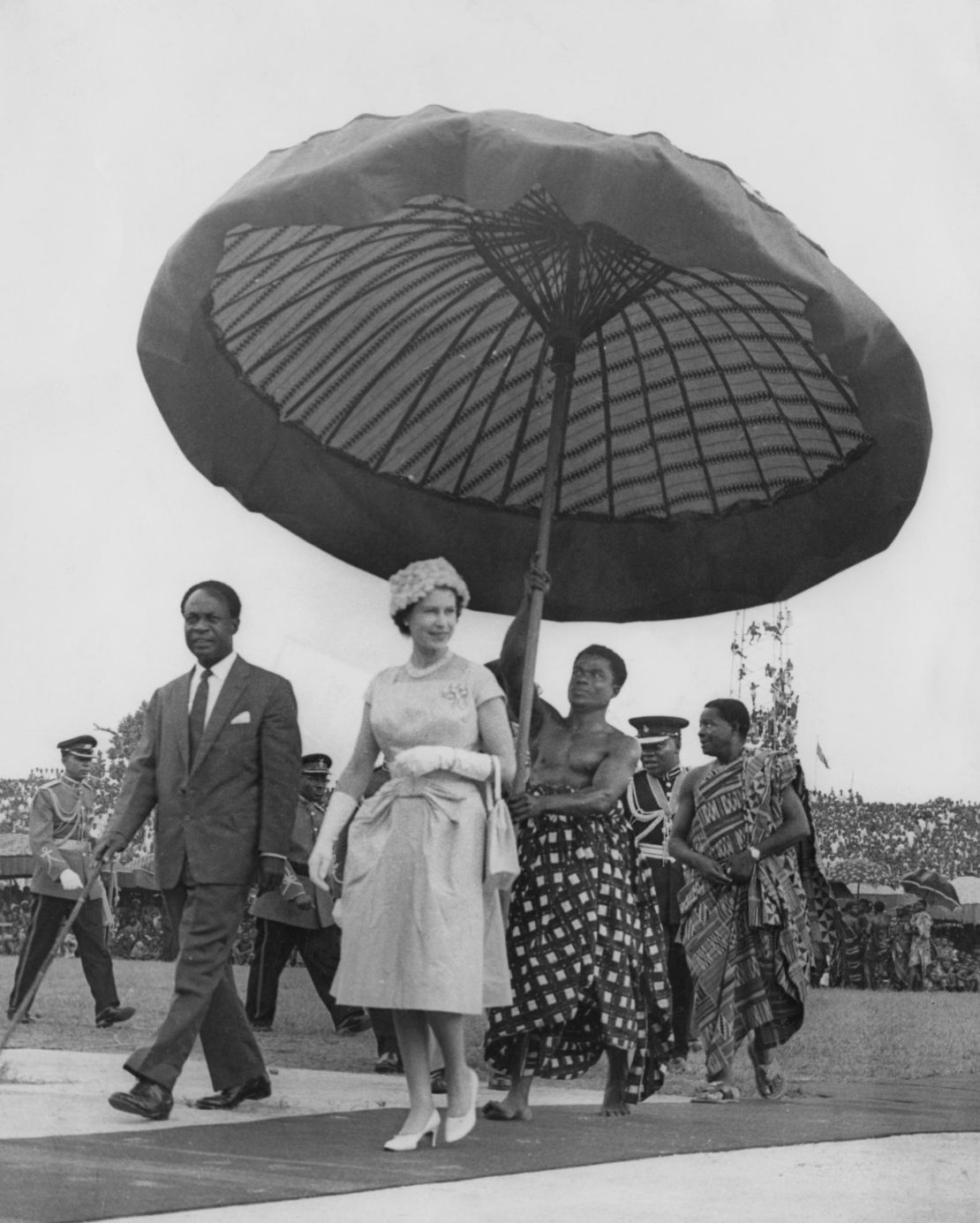 Queen Elizabeth II on her way to the Kumasi Durbah with Kwame Nkrumah, President of Ghana, during her tour of Ghana, November 1961.