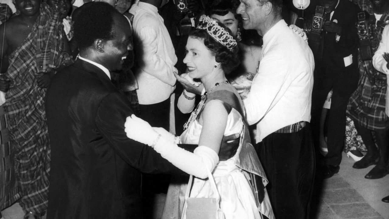 Queen Elizabeth II dances with President Kwame Nkrumah of Ghana, during her visit to Accra, Ghana, in 1961.