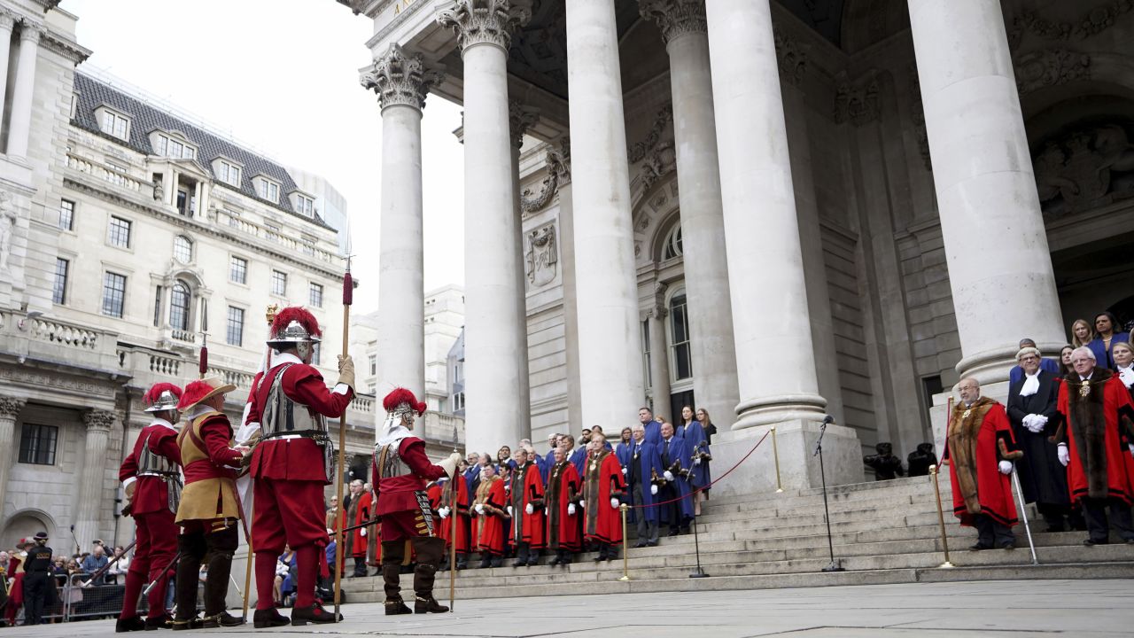 Pikemen and Musketeers of the Honourable Artillery Company, left, stand outside the Royal Exchange in the City of London on Saturday before the reading of the Proclamation of Accession of King Charles III.