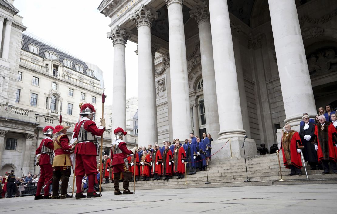 Pikemen and Musketeers of the Honourable Artillery Company, left, stand outside the Royal Exchange in the City of London on Saturday before the reading of the Proclamation of Accession of King Charles III.