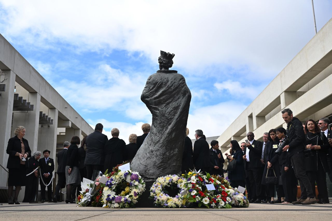 Wreaths are seen at Queen Elizabeth II statue at the Parliament House in Canberra, Australia, on Saturday.