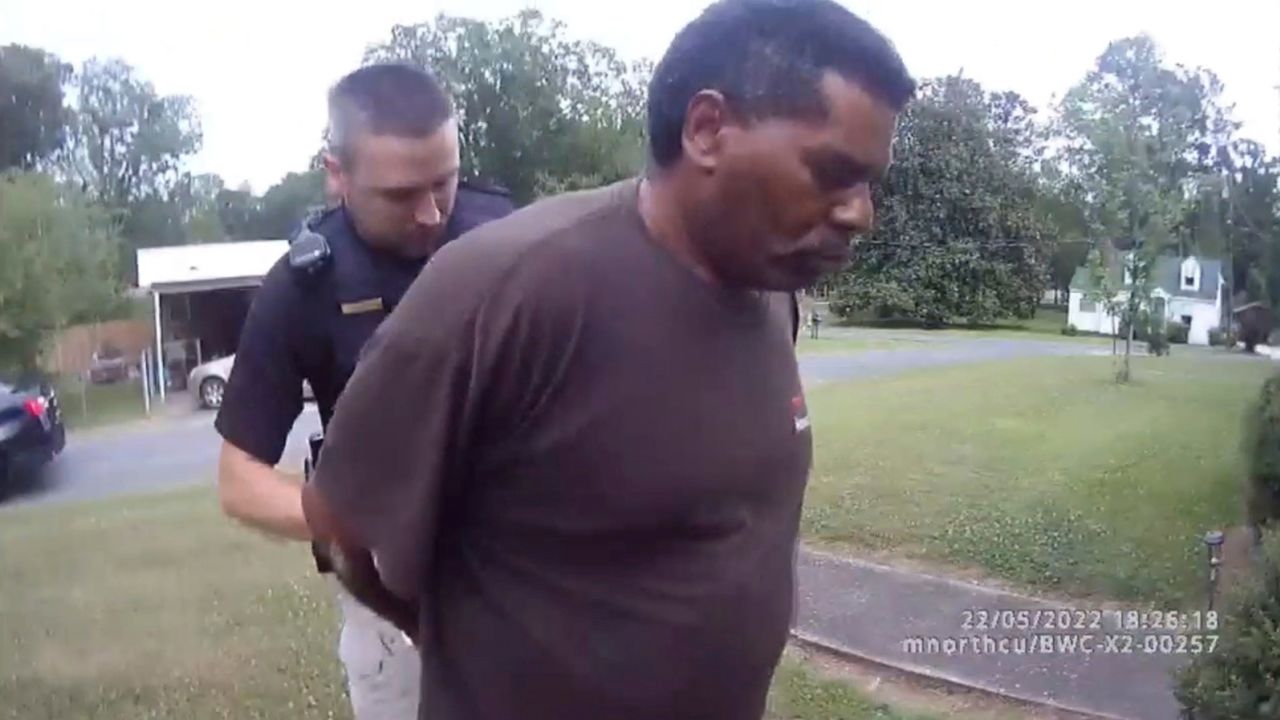 This image captured from bodycam video released by the Childersburg, Alabama, Police Department and provided by attorney Harry Daniels shows Michael Jennings, right, in custody in on May 22, 2022.