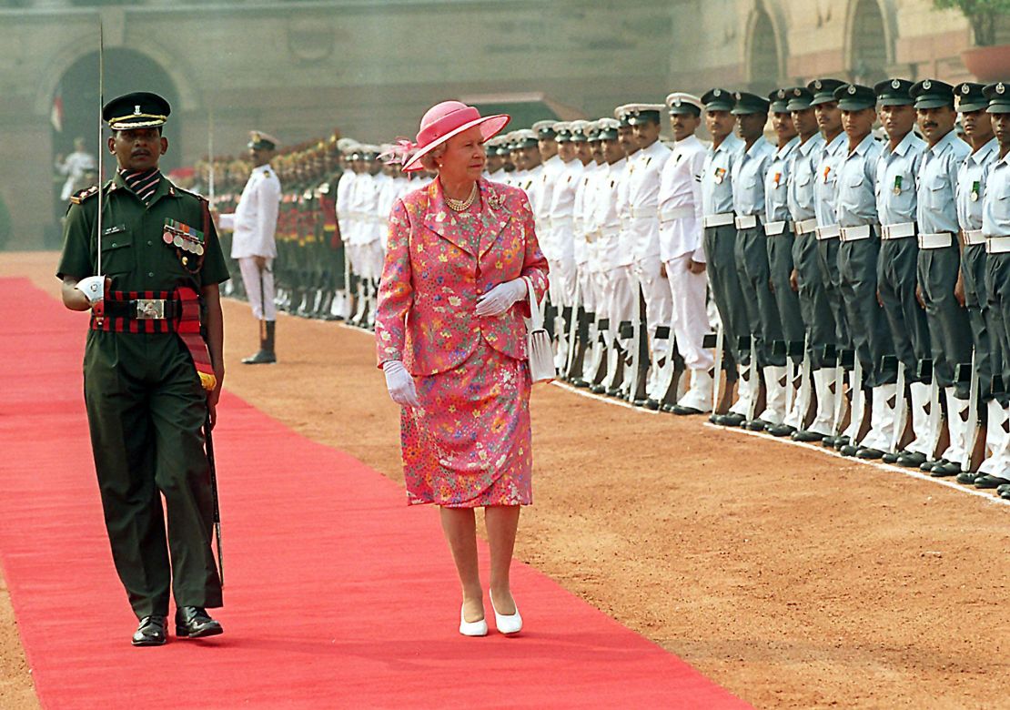 Britain's Queen Elizabeth II inspects a guard of honor at the Presidential palace in New Delhi during her visit to India in 1997. 