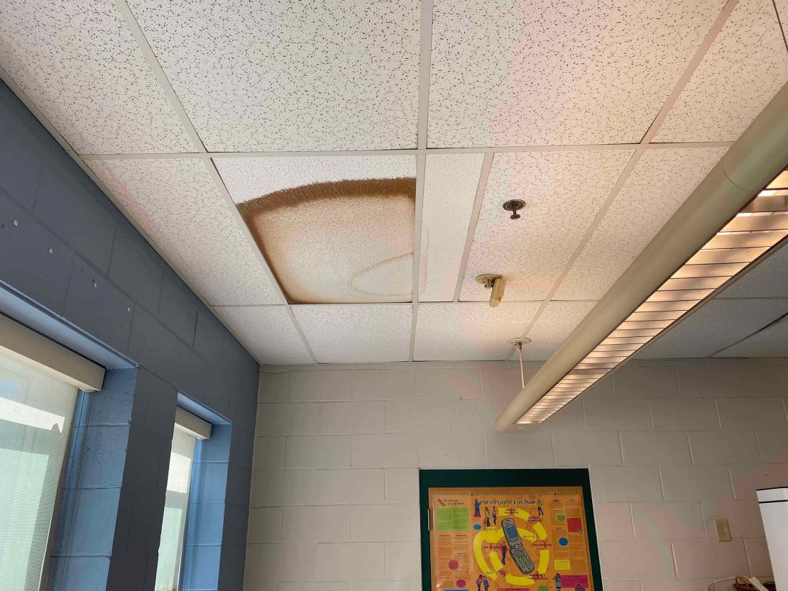 A browning ceiling tile hangs over a room this school year at Joseph G. Pyne Arts Magnet School in Lowell, Massachusetts.