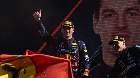 Winner Red Bull Racing's Dutch driver Max Verstappen (C) celebrates with second-placed Ferrari's Monegasque driver Charles Leclerc (L) and third-placed Mercedes' British driver George Russell (R) on the podium after the Italian Formula One Grand Prix at the Autodromo Nazionale circuit in Monza on September 11, 2022. (Photo by Miguel MEDINA / AFP) (Photo by MIGUEL MEDINA/AFP via Getty Images)