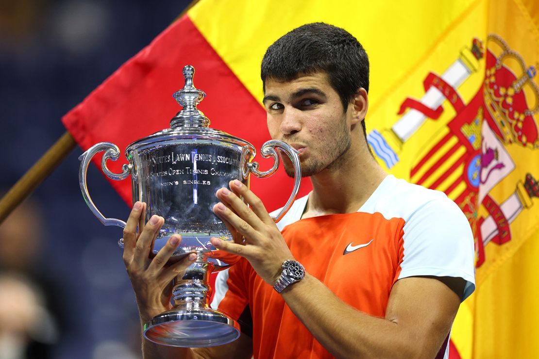 Carlos Alcaraz celebrates with the US Open trophy after defeating Casper Ruud in the final on September 11.