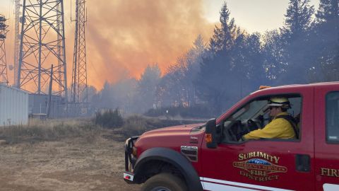 Firefighters battle a wildfire south of Salem, Oregon, on Friday.