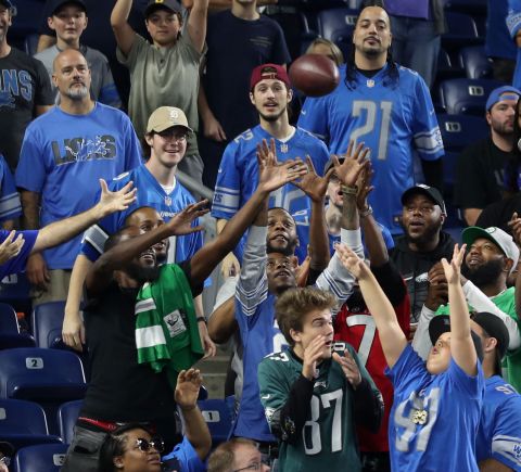Detroit Lions fans play catch with running back Jamaal Williams at Ford Field.  The Lions narrowly fell in a late comeback against the Philadelphia Eagles - scoring 14 points in the 4th quarter - to lose 38-35.
