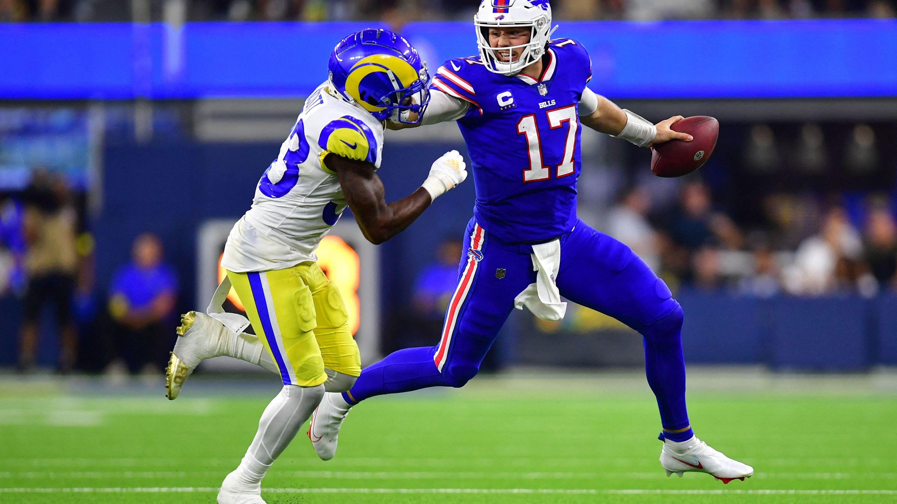 Buffalo Bills quarterback Josh Allen stiff-arms Los Angeles Rams safety Nick Scott in the third quarter of a massive 31-10 win against the defending Super Bowl champions at SoFi Stadium. The statement victory on NFL Opening Day shows the <a href="index.php?page=&url=http%3A%2F%2Fwww.cnn.com%2F2022%2F09%2F10%2Fsport%2Fnfl-team-popularity-buffalo-bills-spt-intl%2Findex.html" target="_blank">Bills are serious contenders</a> for the title in 2022.