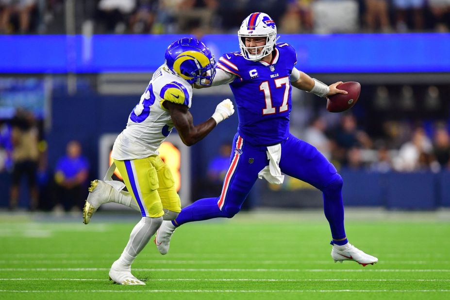 Buffalo Bills quarterback Josh Allen stiff-arms Los Angeles Rams safety Nick Scott in the third quarter of a massive 31-10 win against the defending Super Bowl champions at SoFi Stadium. The statement victory on NFL Opening Day shows the <a href="http://www.cnn.com/2022/09/10/sport/nfl-team-popularity-buffalo-bills-spt-intl/index.html" target="_blank">Bills are serious contenders</a> for the title in 2022.
