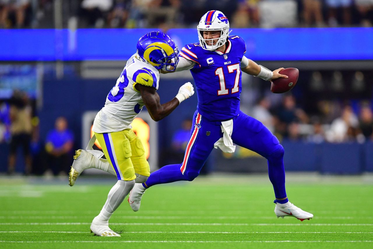 Buffalo quarterback Josh Allen stiff-arms Los Angeles Rams safety Nick Scott during the NFL season opener on Thursday, September 15. Allen threw three touchdowns and ran for a fourth as the Bills crushed the defending champion Rams 31-10. <a href=