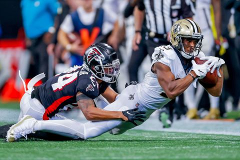 New Orleans Saints wide receiver Michael Thomas (R) holds a reception against Atlanta Falcons cornerback AJ Terrell (L) during the second half of their game in Atlanta September 11.  Thomas had two TD catches that day as the Saints outscored the Falcons 14 in the fourth to win 27-26.