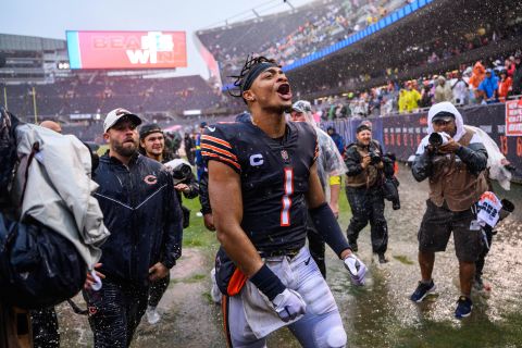 Chicago Bears quarterback Justin Fields celebrates after the Bears' 19-10 win over the San Francisco 49ers at Soldier Field.  Fields threw for two touchdowns on a rainy day in Chicago.