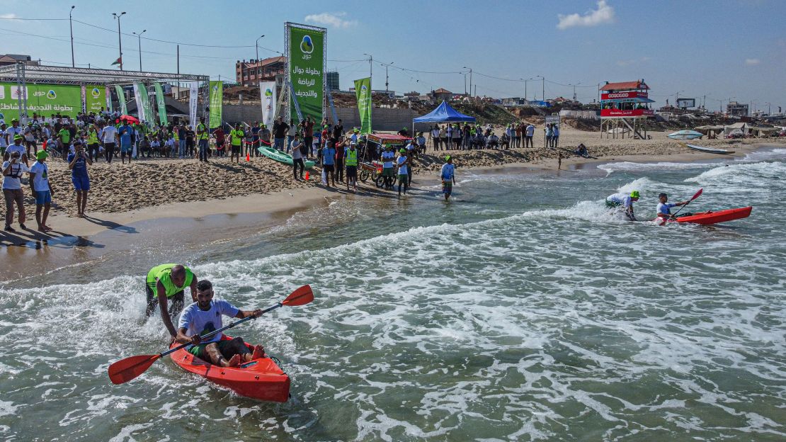 Palestinians take part in a local canoeing championship off the coast of Gaza City, on Sunday.