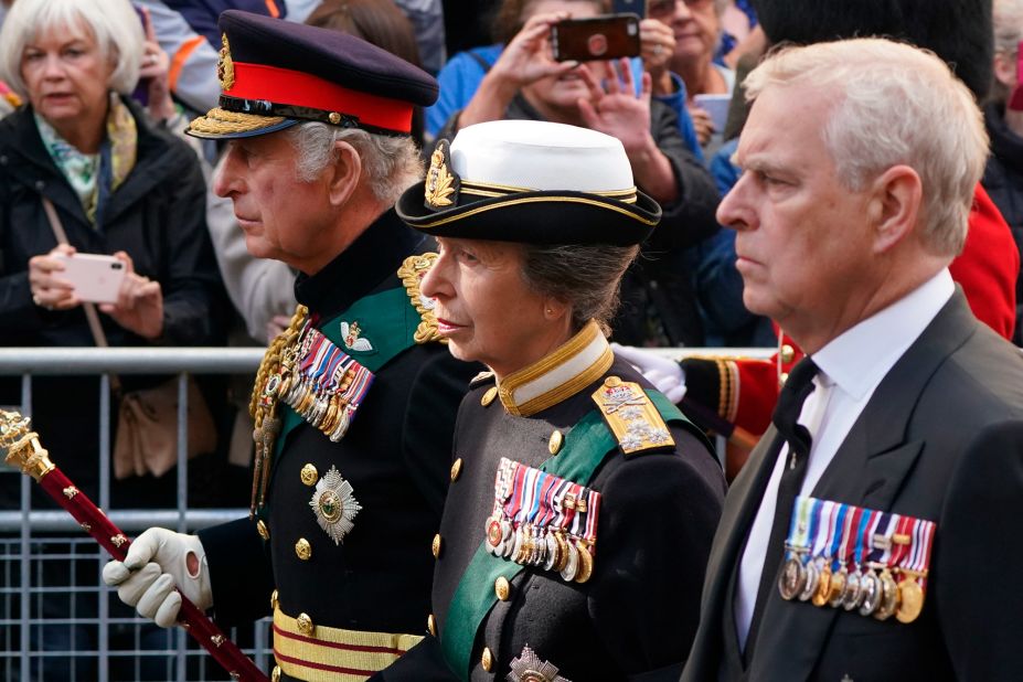 From left, the King, Princess Anne and Prince Andrew follow the hearse through the streets of Edinburgh on September 12.