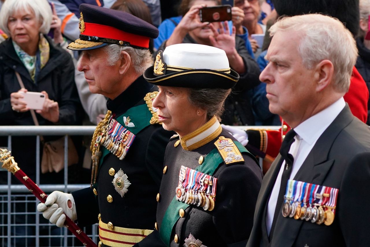 From left, the King, Princess Anne and Prince Andrew follow the hearse through the streets of Edinburgh on September 12.