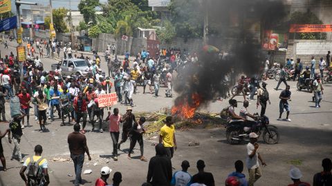 People locomotion  astir   burning tires acceptable   up   by protesters during a protestation  to request  that Haitian Prime Minister Ariel Henry measurement   down   and a telephone  for a amended  prime   of life, successful  Port-au-Prince, Haiti, Wednesday, Sept. 7, 2022. (AP Photo/Odelyn Joseph)