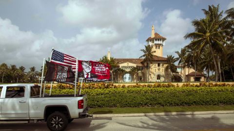 A truck displaying pro-Trump flags is driven past Mar-a-Lago in Palm Beach, the home of former President Donald Trump, on Tuesday, Aug. 9, 2022.